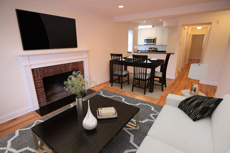 a living room with a fireplace and a table